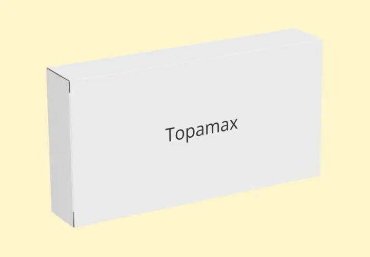 Białe pudełko z napisem Topamax na jasnym tle.